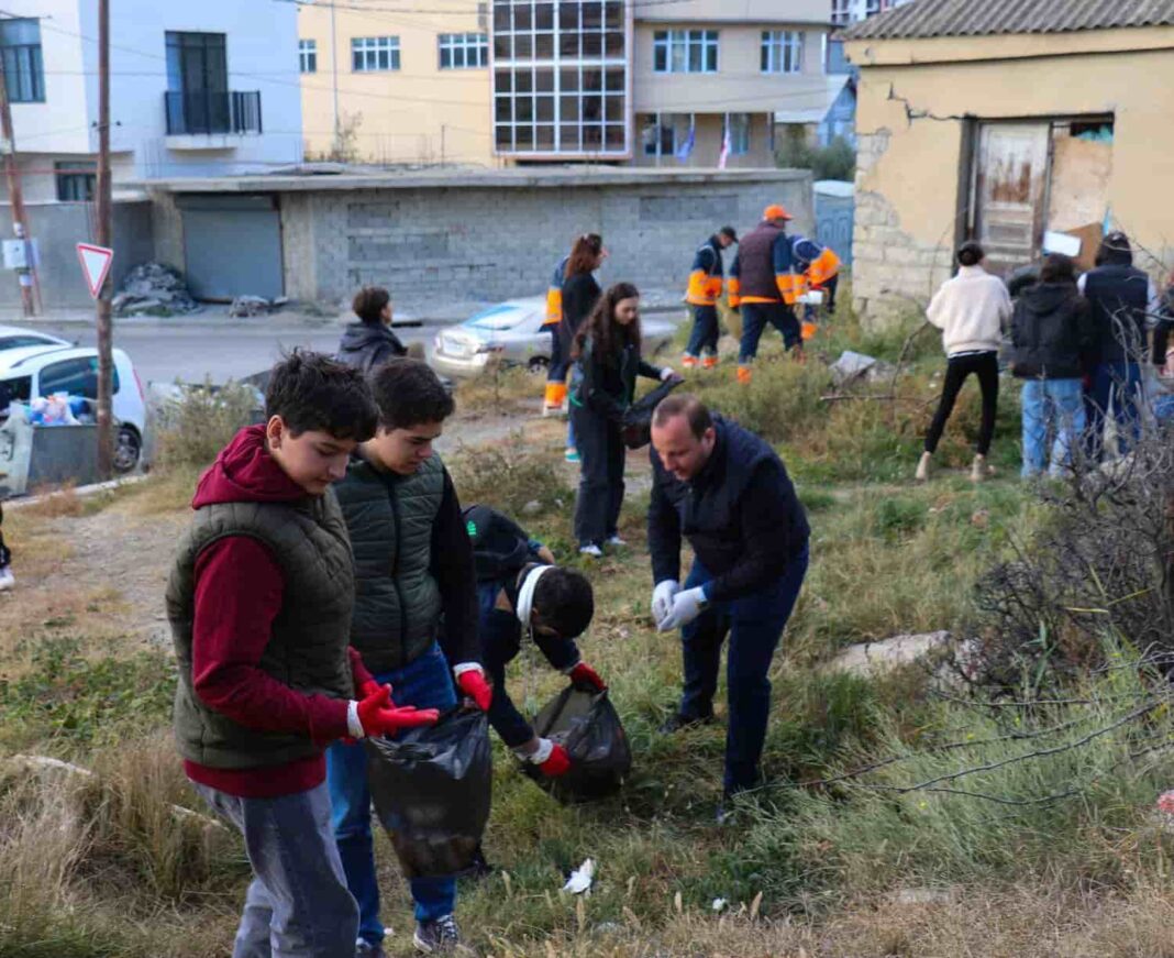 Students of Tbilisi Public School clean Mukhiani building credit: facebook